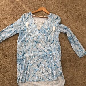 Bright, tropical beach cover up.  3/4 sleeve.  Hooded. Never been worn.